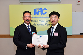 Mr Rimsky Yuen, SC, LRC Chairman, awarded a certificate to Mr Chau Ching Shing, Brian