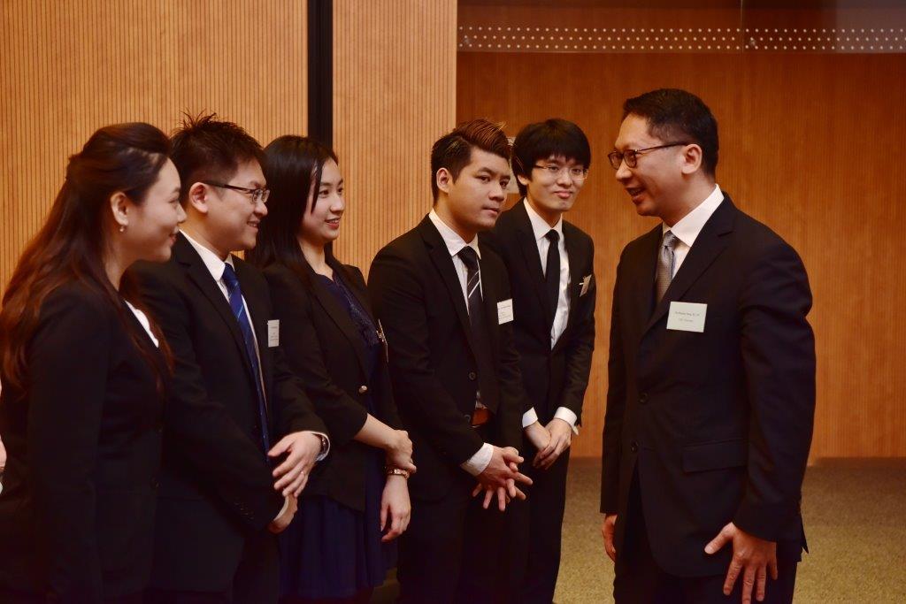 Mr Rimsky Yuen, SC, LRC Chairman talking with the finalists