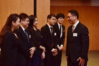 Mr Rimsky Yuen, SC, LRC Chairman talking with the finalists