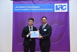 Mr Rimsky Yuen, SC, LRC Chairman, awarded a certificate to Mr Tse Shing Chung, Anthony