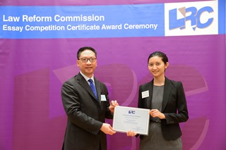 Mr Rimsky Yuen, SC, LRC Chairman, awarded a certificate to Miss Lo Amanda Kar Hei