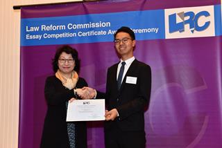 Ms Teresa Cheng, SC, LRC Chairman, awarded a certificate to Mr Ho Lok Hei