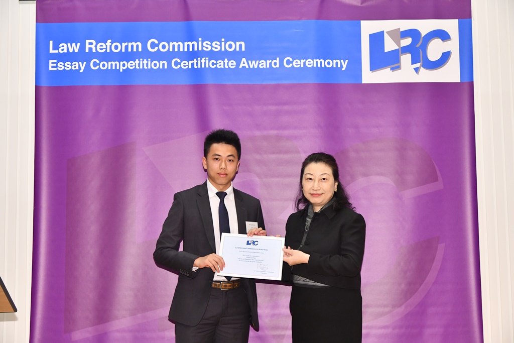 Ms Teresa Cheng, SC, LRC Chairman, awarded a certificate to Mr Chan Pak Hay