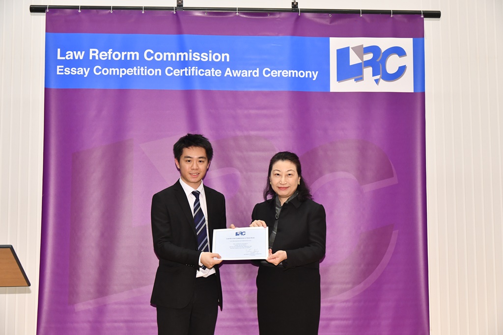 Ms Teresa Cheng, SC, LRC Chairman, awarded a certificate to Mr Cheng Hoi Fai Herbert